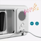 White electronic device with speaker and volume control buttons on a light gray background